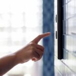 woman-pressing-elevator-button-53876-94757